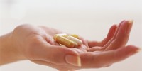 Woman Holding Vitamins